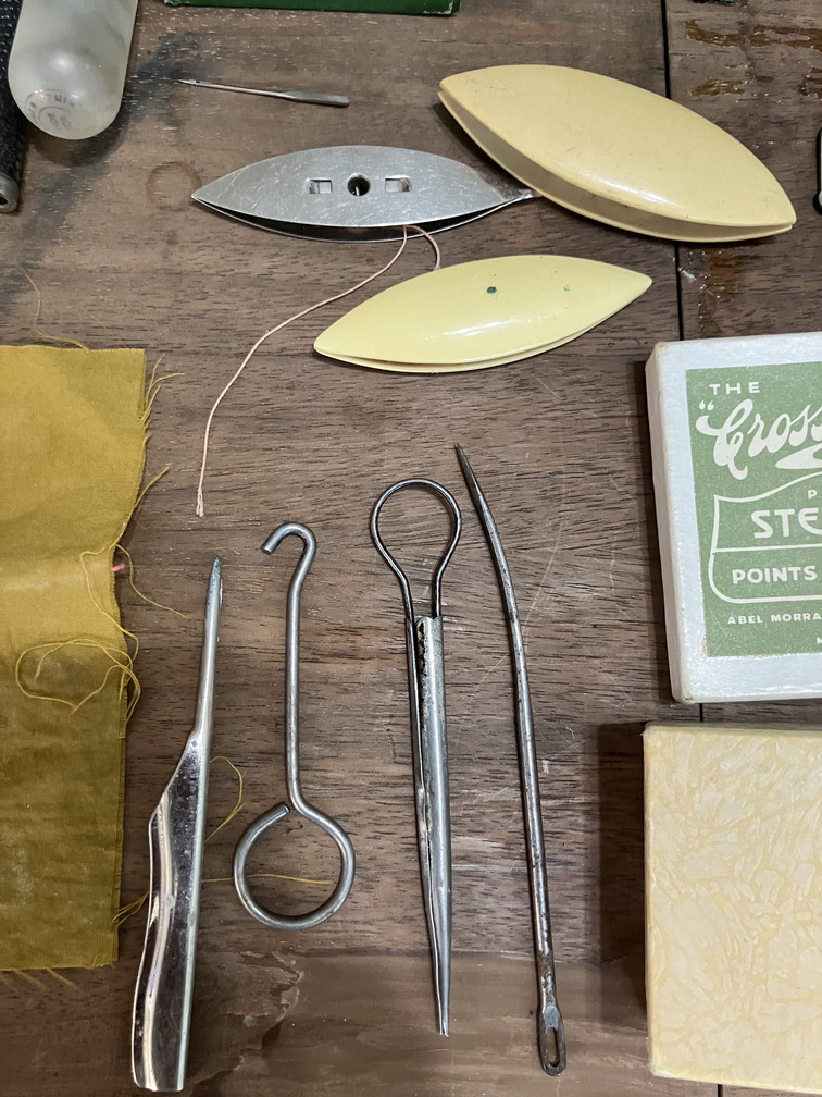 Shuttles, hooks and needle threaders